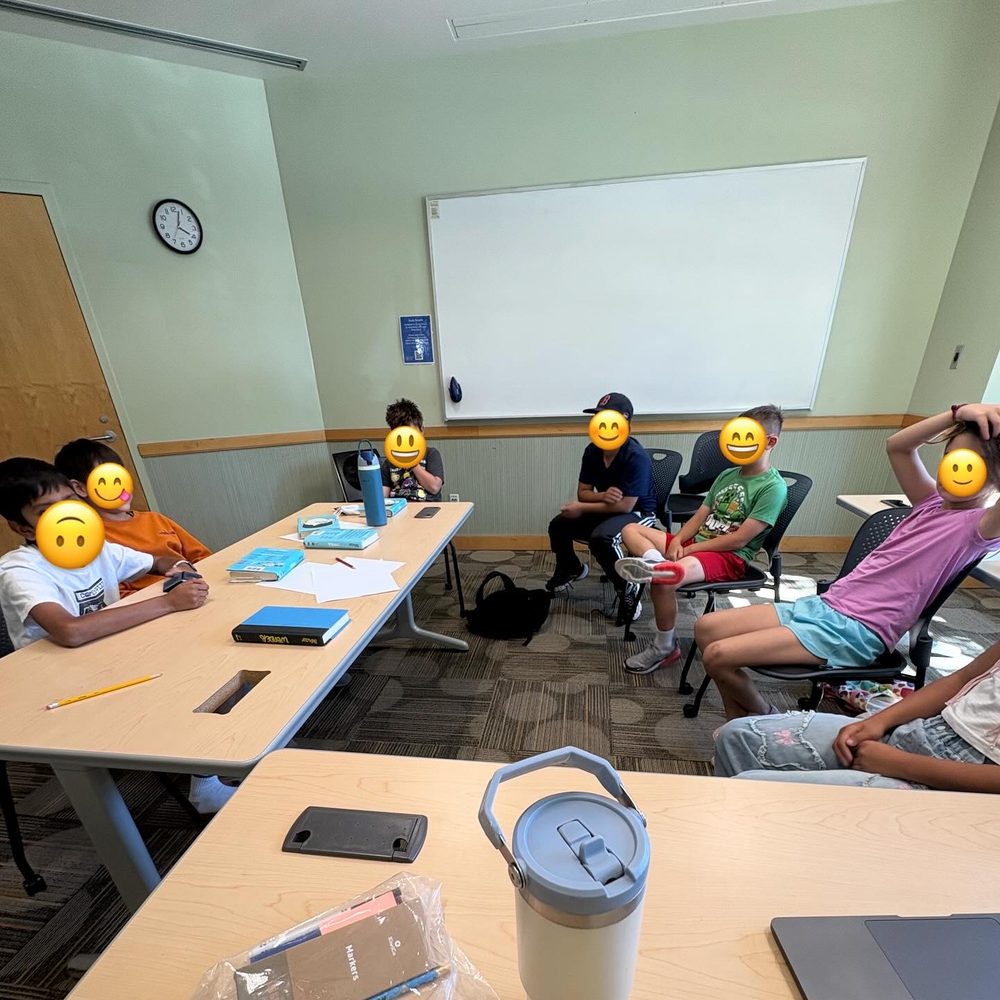 Kids gathered together chatting during a book club session